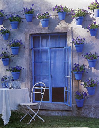 Blue Pots with Pansies   Adorable. I would do in Green Pots with pretty greenery and white flowers in them. (match my house/yard) Would be very pretty way to bring some life to an old shed wall .: 