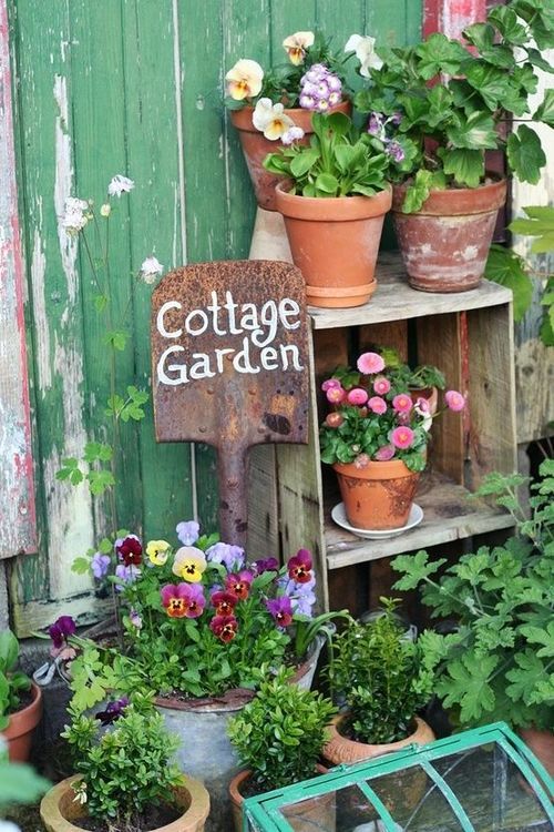 Sign printed on old shovel in a vintage cottage garden display; Upcycle, Recycle, Salvage, diy, thrift, flea, repurpose!  For vintage ideas and goods shop at Estate ReSale & ReDesign, Bonita Springs, FL